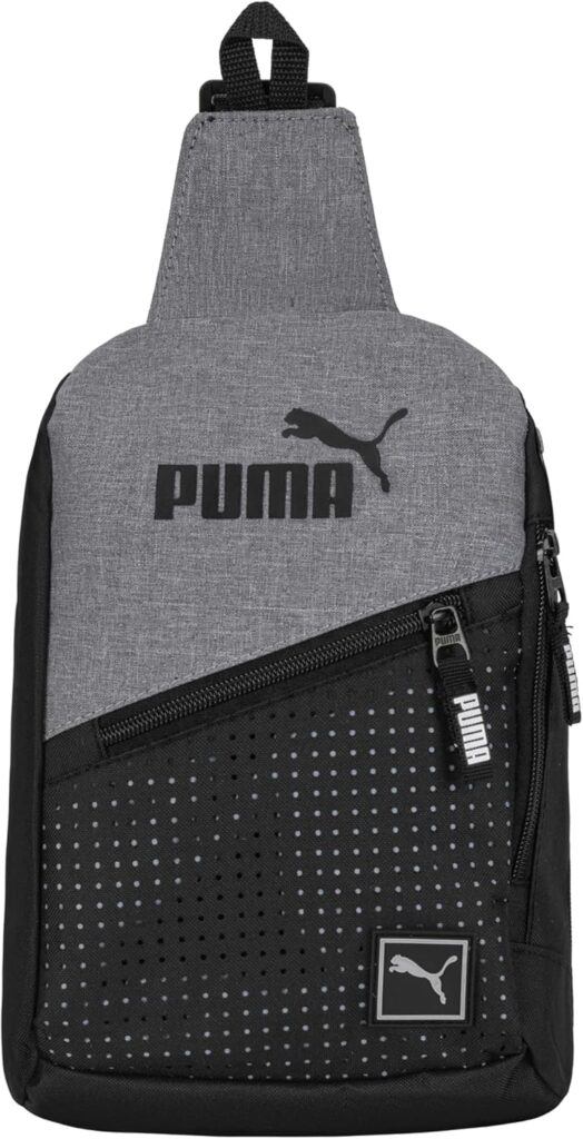 A gray and black Puma sling backpack with a diagonal zipper pocket, dotted pattern, and Puma logo on the front. The bag has a single strap at the top for carrying.