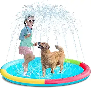 A young girl wearing sunglasses and a dog play together on a colorful non-slip splash pad, with water spraying up like a sprinkler fountain all around them.