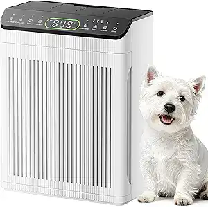 A white air purifier with a digital display on top is placed next to a small, fluffy white dog sitting and looking at the camera.