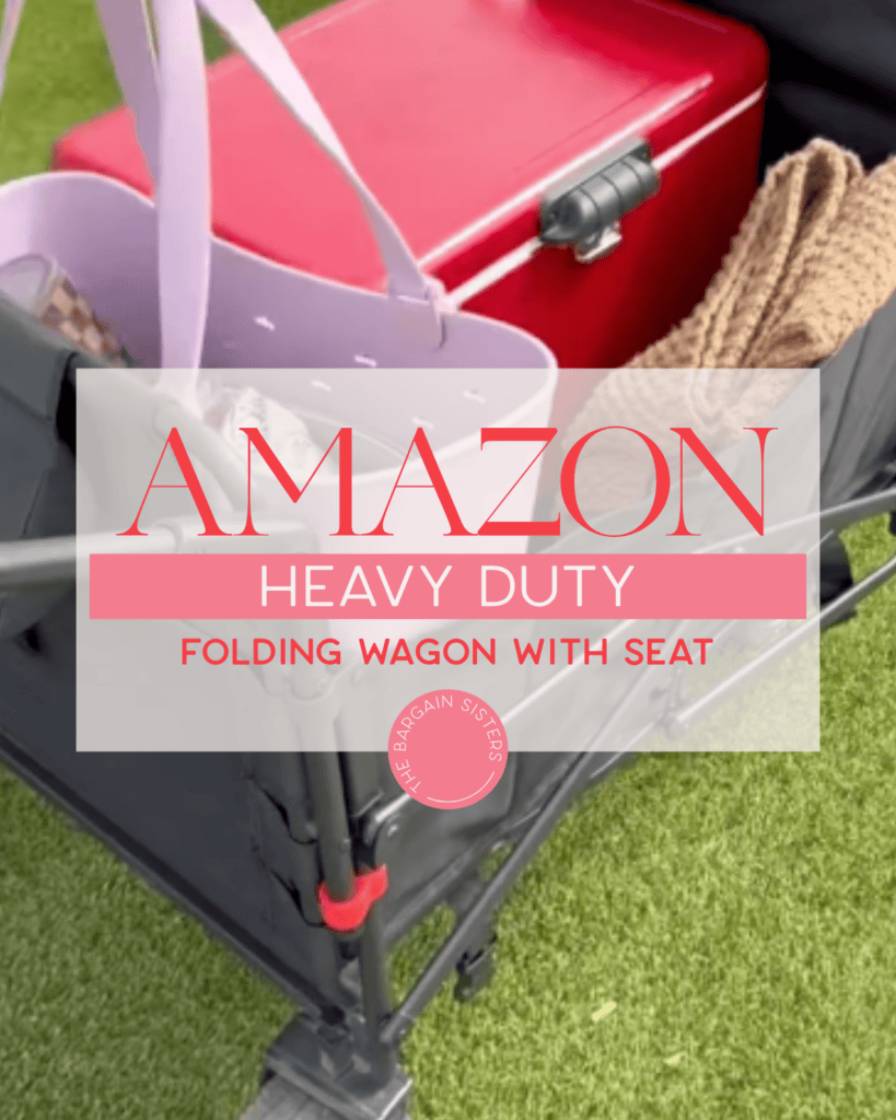 A red cooler, a pink tote bag, and a tan blanket are placed inside a gray folding wagon with a seat on green grass. Text overlay reads: "AMAZON Heavy Duty Folding Wagon with Seat.