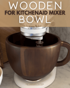 A KitchenAid mixer fitted with a large, dark wooden mixing bowl with a handle, shown on a marble countertop. Text overlay reads, "Wooden For KitchenAid Mixer Bowl.
