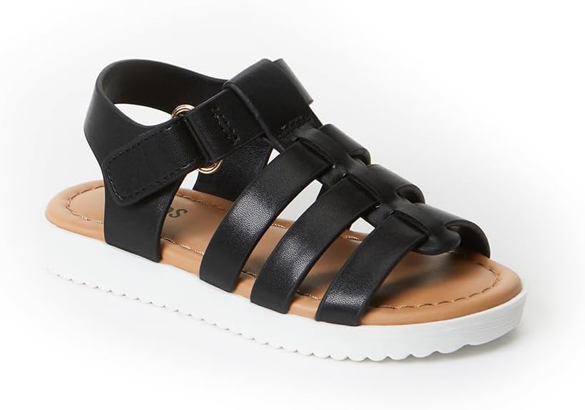 A black gladiator-style sandal with multiple straps, a tan insole, and a thick white ridged sole, designed for casual wear.