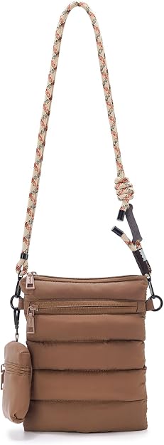 A brown, quilted crossbody bag with two front zippers, a small matching pouch attached, and a beige rope strap with red accents and a large knot—perfect for adding style to your daily routine. Don’t miss out on this chic accessory during our Tuesday Deals!.
