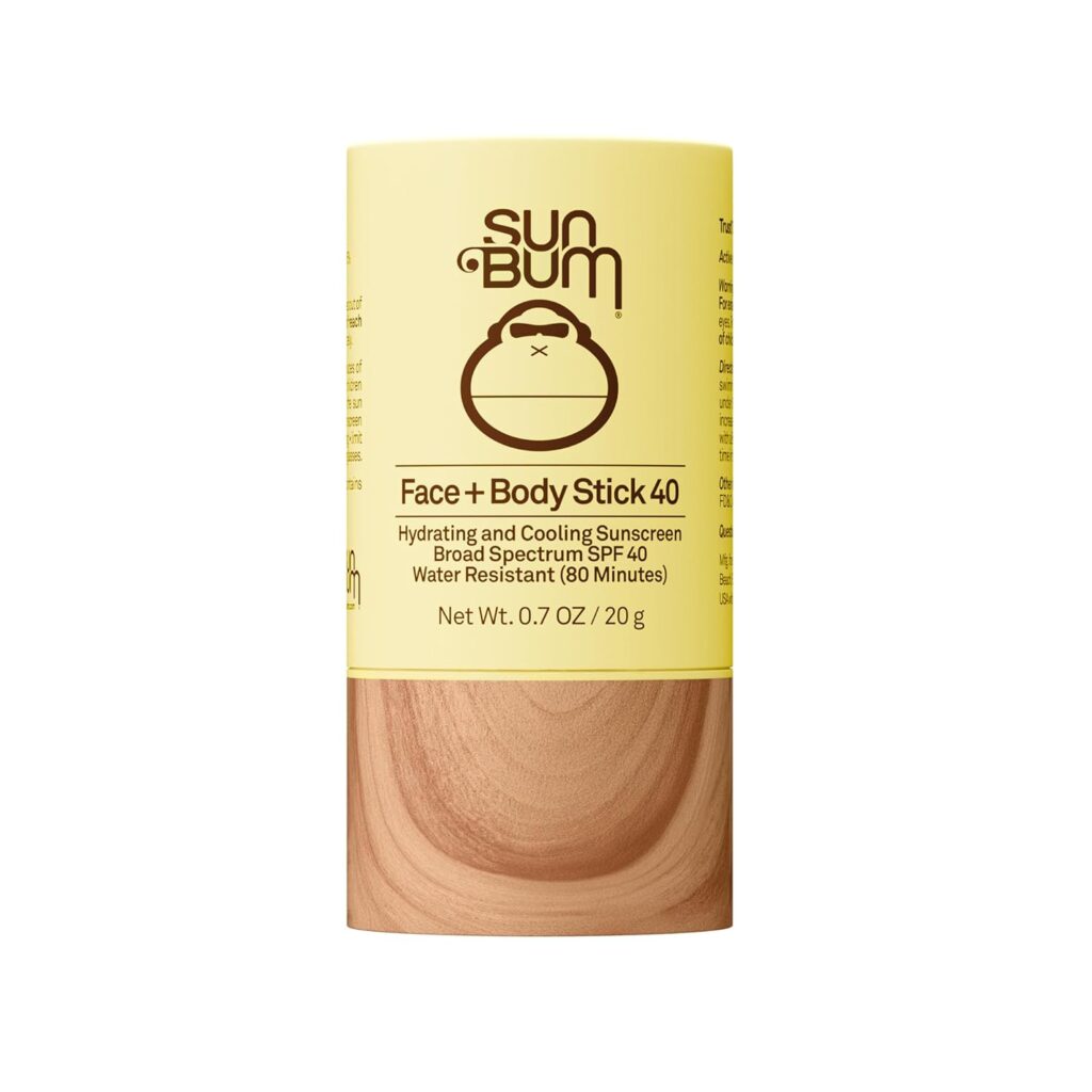 A yellow and wood-patterned tube of Sun Bum Face + Body Stick 40 sunscreen with SPF 40, featuring the Sun Bum logo and details about its hydrating, cooling, and water-resistant properties—perfect for snagging in our Thursday Deals.