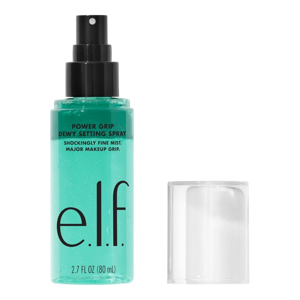 A bottle of e.l.f. Power Grip Dewy Setting Spray with a clear cap placed beside it. The bottle contains 2.7 fl oz (80 mL) of product and features a black spray nozzle.