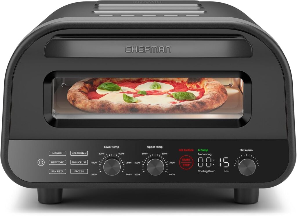 A CHEFMAN Indoor Pizza Oven sits on the counter, its digital display showing 1:15, control knobs ready for use. Inside, a pizza with mozzarella, tomato sauce, and basil bakes to perfection. Enjoy 50% off this pizza oven today!.