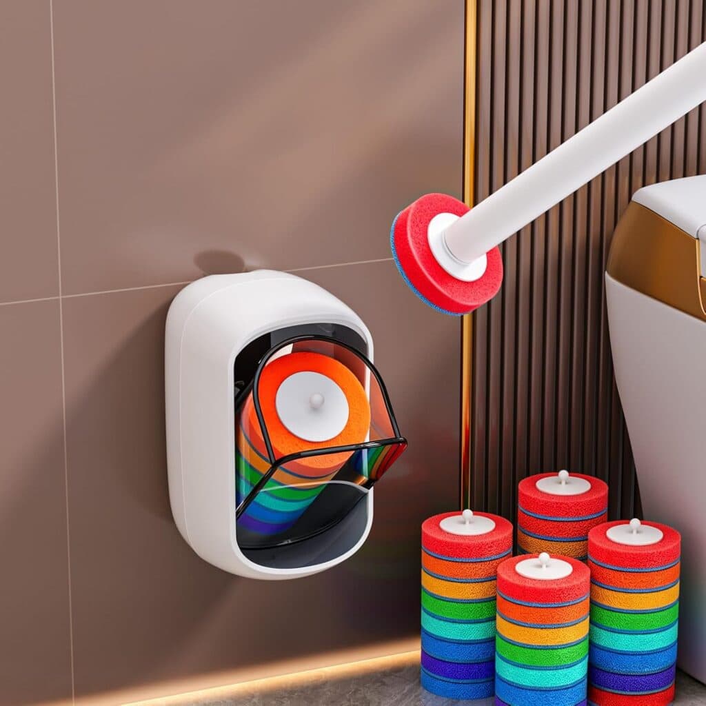 Colorful round scrub pads stacked on the floor, with one pad attached to a white cleaning rod. A white wall-mounted holder stores more pads and has a transparent cover. The scene is set in a modern, tiled bathroom—perfect for sprucing up your routine while taking advantage of exclusive Tuesday Deals.