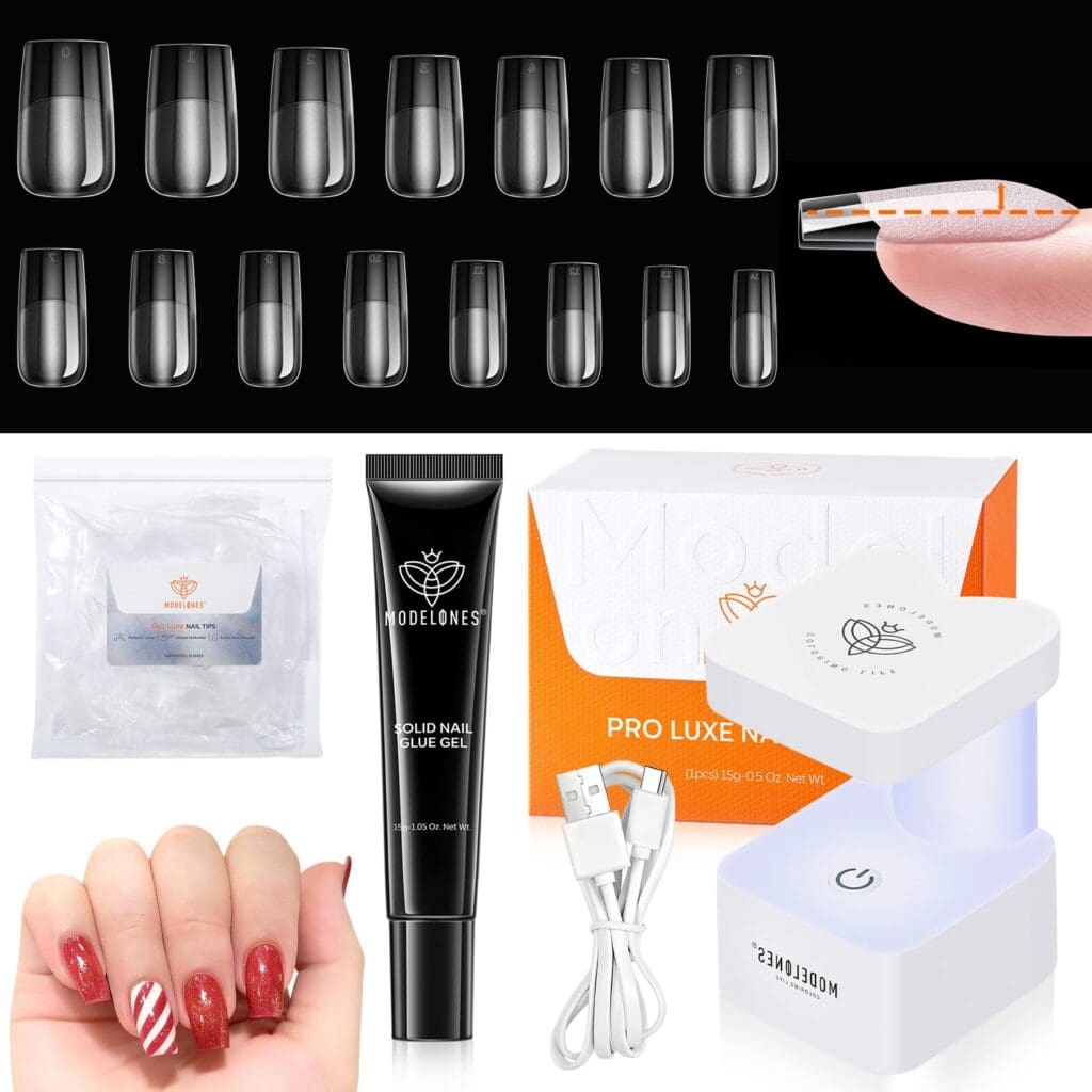 A nail extension kit with clear nail tips, nail glue gel, a white LED lamp with USB cable, a small bag of tools, and a hand showing red and candy cane-striped nail art.
