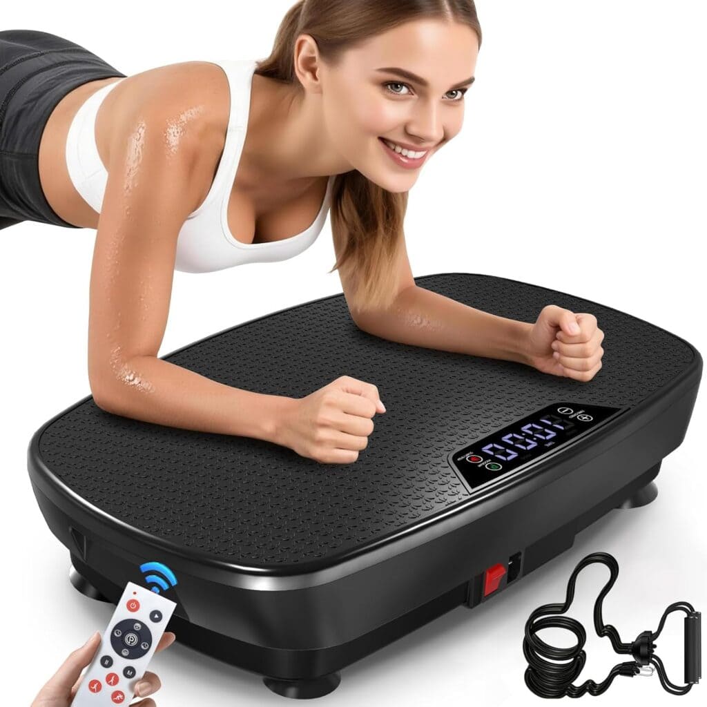 A woman in workout clothes is planking on a black vibration plate with a digital display. Nearby are a remote control and two resistance bands. She is smiling and appears to be exercising.