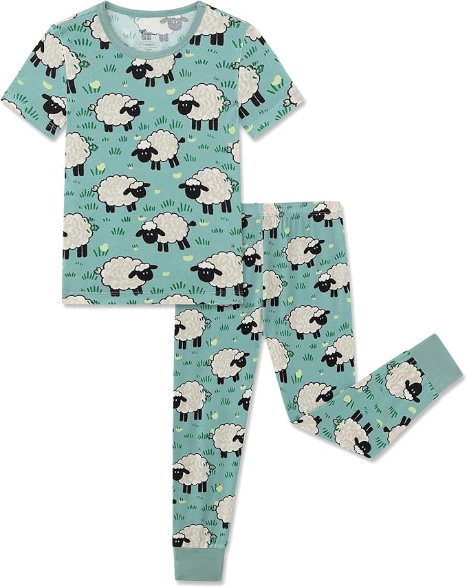 A matching pajama set with a short-sleeve top and long pants in light blue, featuring a playful pattern of white sheep and green grass.