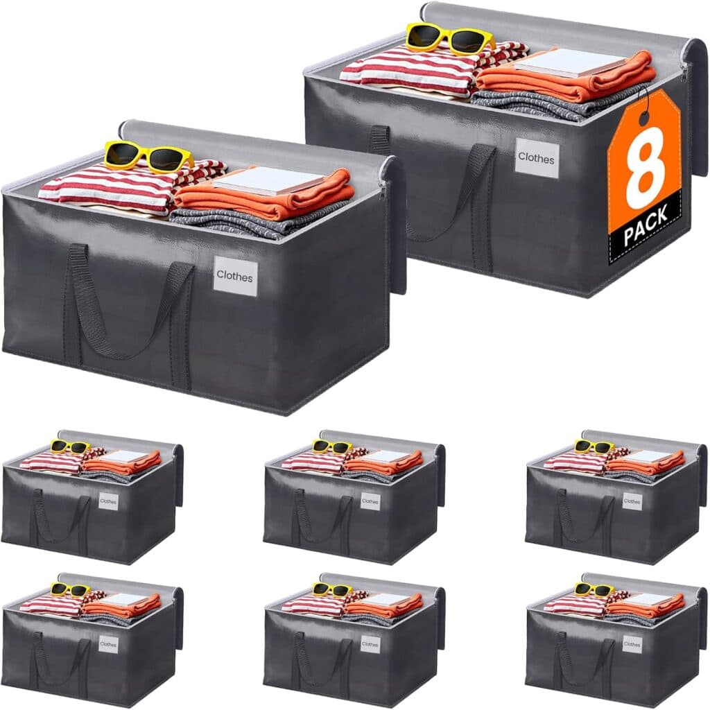 Eight gray storage bags labeled "Clothes," some filled with folded clothes and sunglasses, are arranged in two rows. One bag displays an orange tag that reads "8 Pack." Perfect for organizing your wardrobe, these space-saving essentials are ideal for grabbing during Tuesday Deals.
