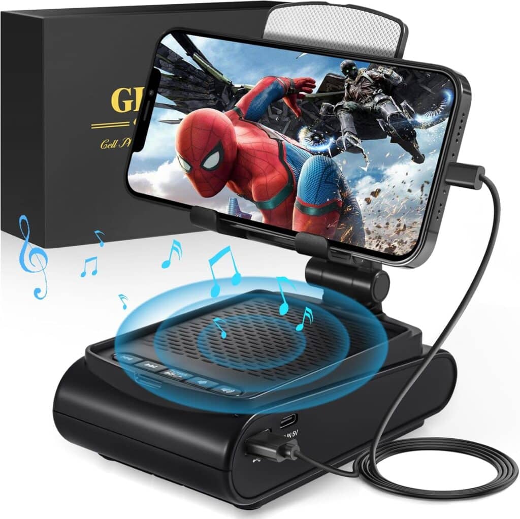 A smartphone displaying Spider-Man is mounted on a black speaker with blue musical notes illustrating sound. The device is connected by a cable, while a gift box in the background hints at exciting Tuesday Deals.