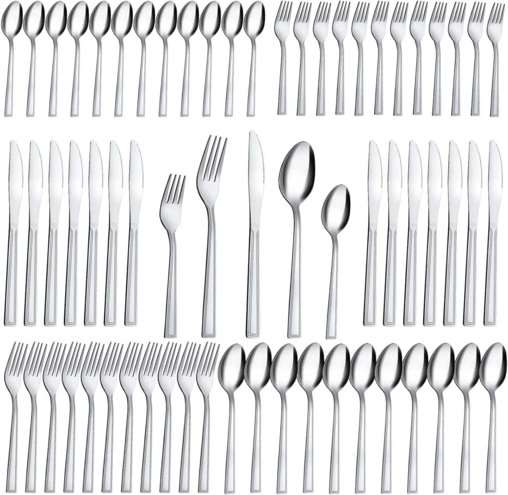 A large set of stainless steel cutlery arranged neatly, including knives, forks, and spoons of various sizes, all aligned in rows on a white background.