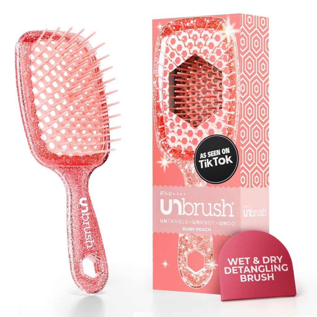 A sparkly pink paddle hairbrush with soft bristles is shown next to its matching box labeled "Unbrush." The packaging highlights features like "Wet & Dry Detangling Brush" and "As Seen On TikTok.