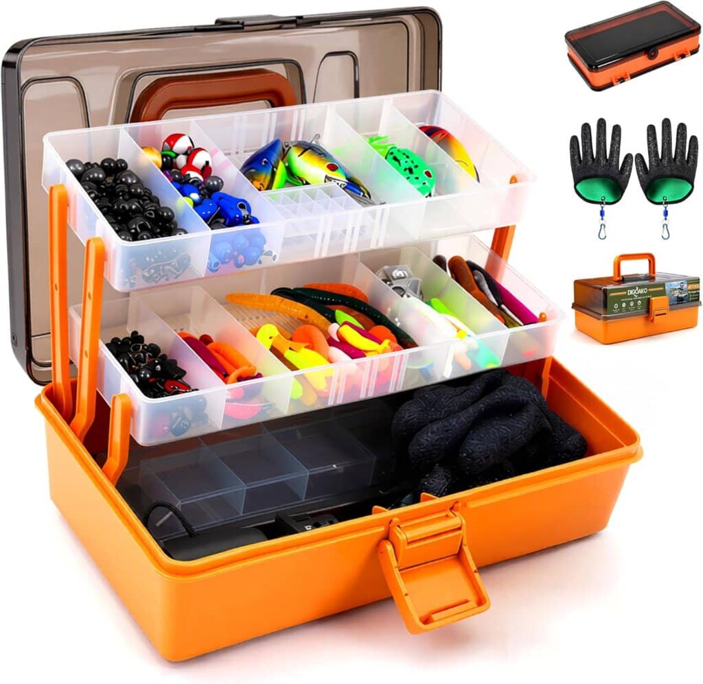 An orange tackle box with three clear, tiered trays holding various fishing lures, hooks, and accessories. Nearby are green fish-shaped gloves, the closed box, and a black tray with orange edges.