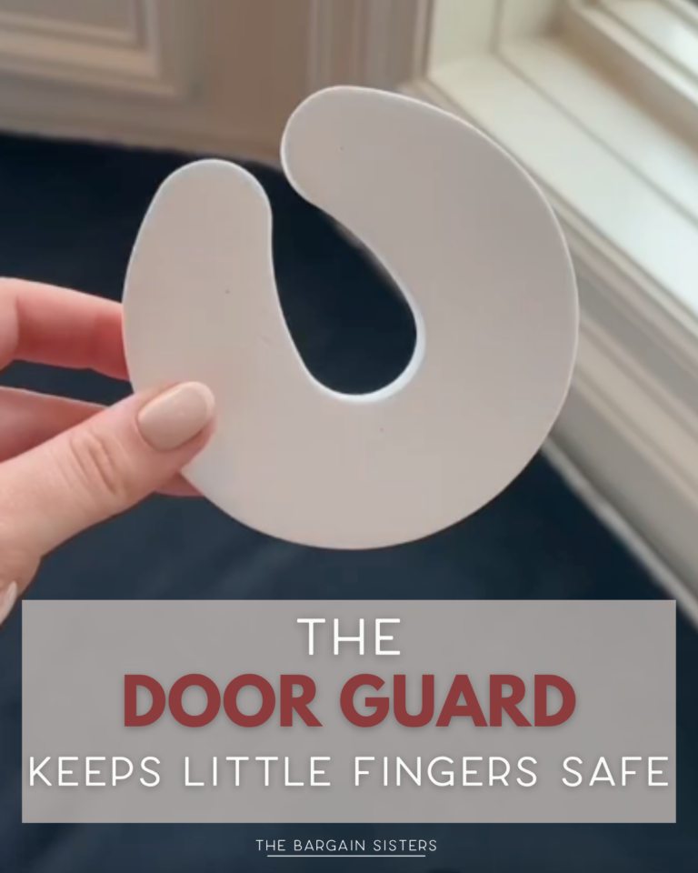 A hand holds a white, C-shaped foam door guard near a window. Text overlay reads, “The door guard keeps little fingers safe. The Bargain Sisters.”.