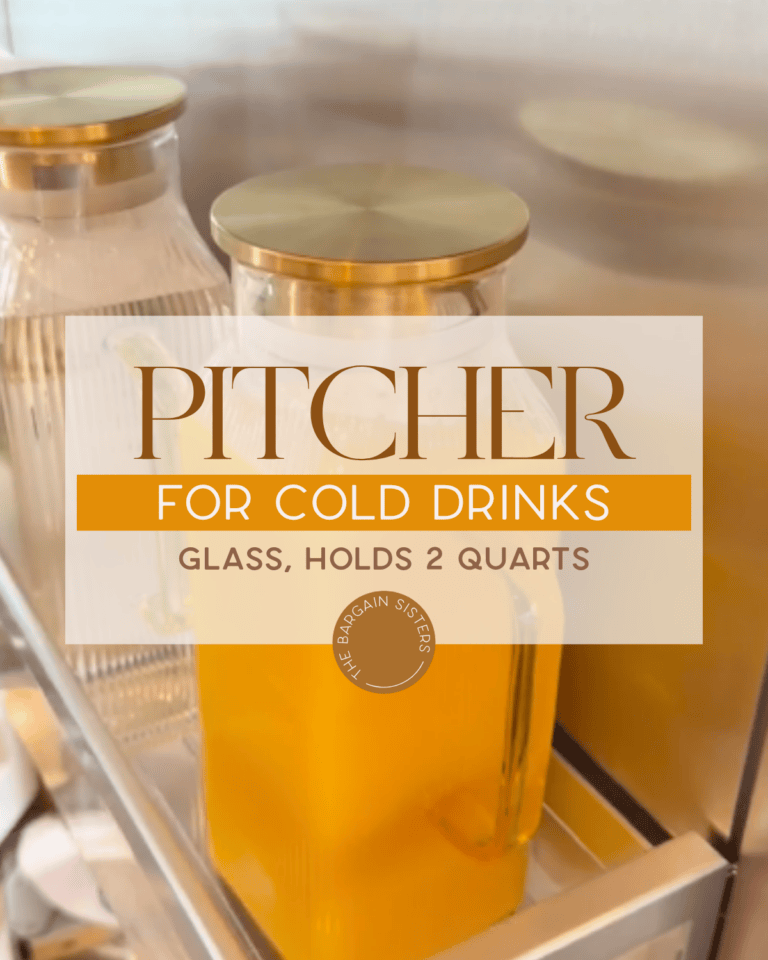 A glass pitcher with a gold lid is filled with an orange drink, sitting next to another clear pitcher. Text overlay reads: "Pitcher for Cold Drinks. Glass, Holds 2 Quarts.