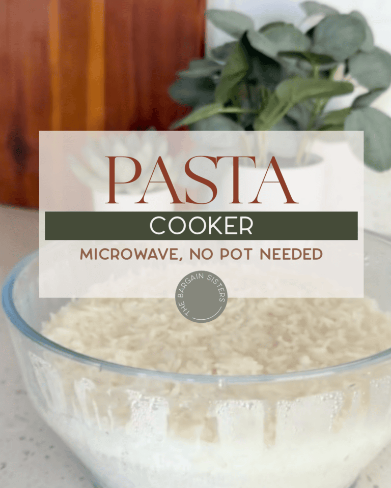A glass bowl filled with cooked pasta sits on a counter; text over the image reads "PASTA COOKER, MICROWAVE, NO POT NEEDED." A plant is blurred in the background.