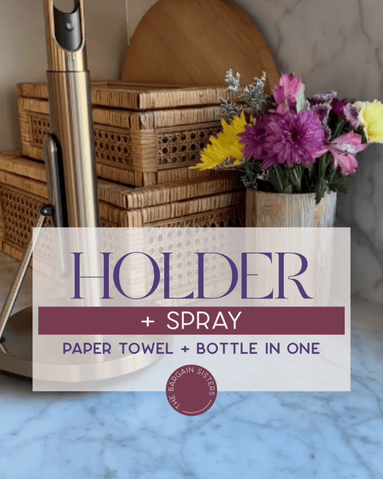 A kitchen counter with a paper towel holder, stacked wicker baskets, a cutting board, and a vase of colorful flowers. Text overlay reads "HOLDER + SPRAY Paper towel + bottle in one.