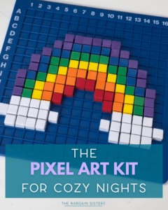 A blue board with a rainbow pixel art design made from colored cubes. Text on the image reads: "The pixel art kit for cozy nights. The Bargain Sisters.