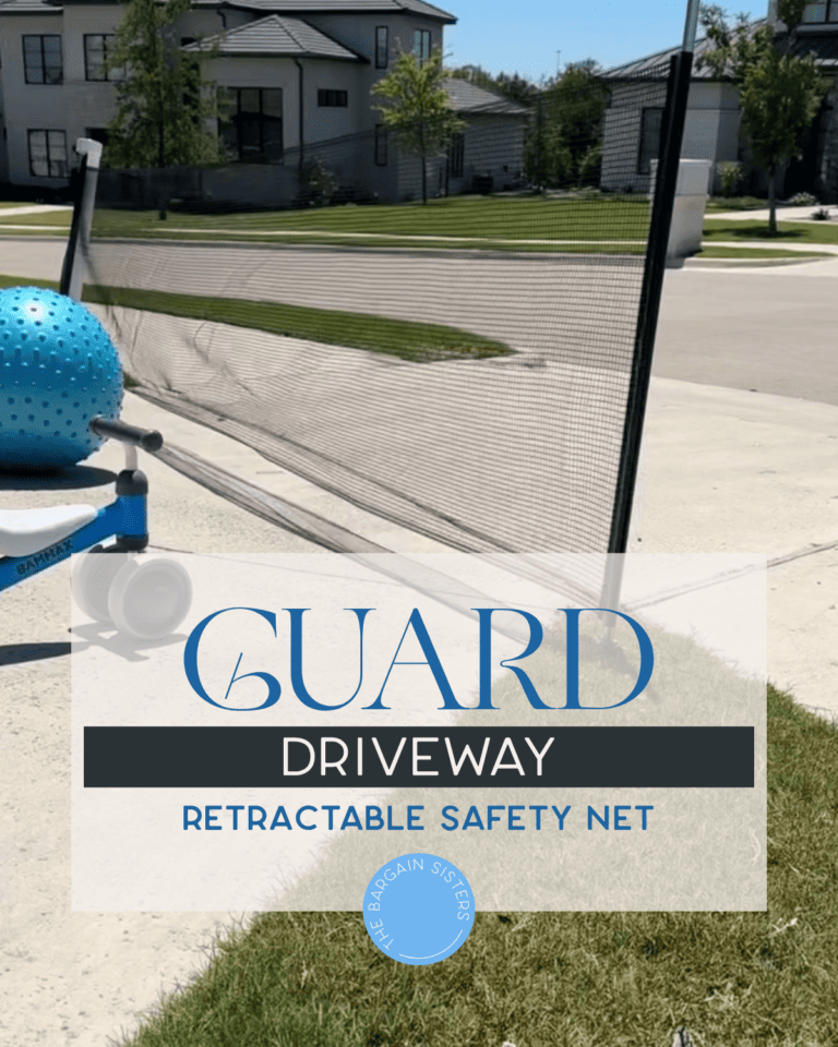 A retractable safety net stretches across a driveway in a suburban neighborhood. A blue ball sits near the net. Text overlay reads: "GUARD DRIVEWAY RETRACTABLE SAFETY NET.