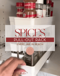 A hand pulls out a white spice rack from a cabinet, revealing jars of spices such as parsley flakes and red pepper, with the text overlay: "Spices Pull-Out Rack: Every Jar in Reach.
