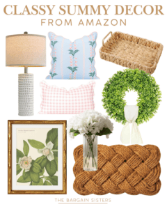 A collage of summer decor items from Amazon, featuring best summer essentials like a woven tray, beige lamp, blue and pink throw pillows, a round wreath, floral artwork in a gold frame, a vase with white flowers, and a braided doormat.