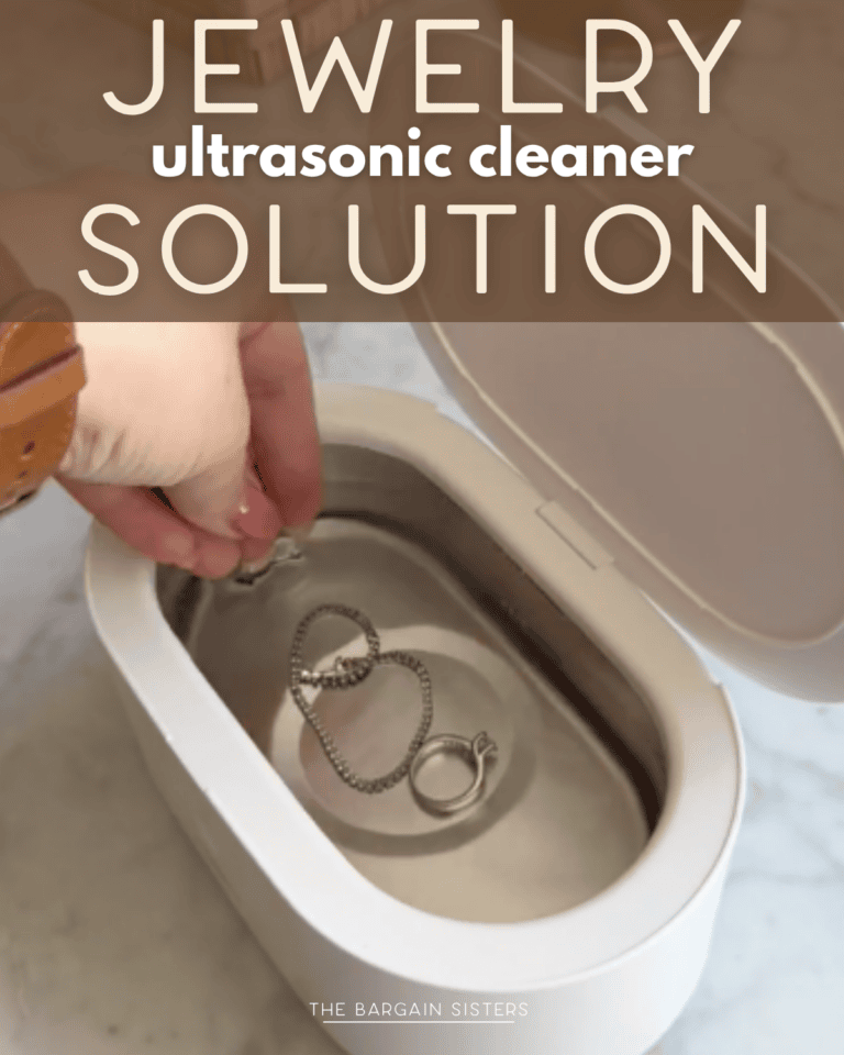 A hand places jewelry into a white ultrasonic cleaner filled with solution. Text on the image reads "Jewelry Ultrasonic Cleaner Solution.