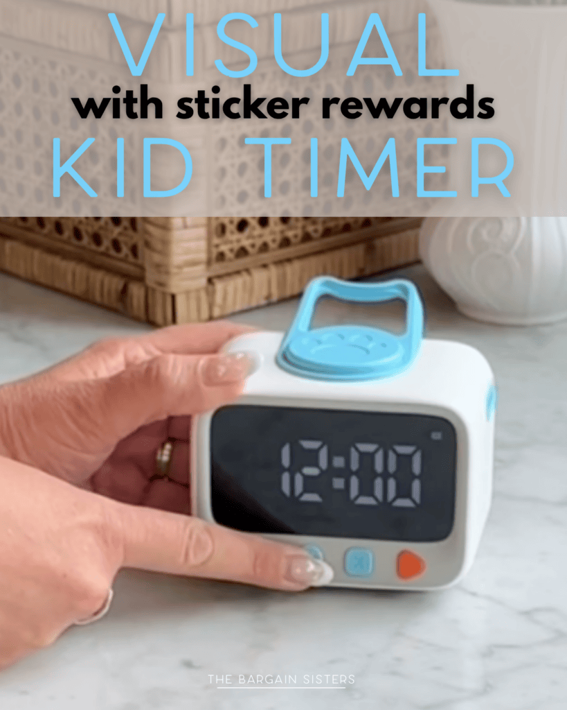 A hand presses a button on a white and blue digital timer displaying "12:00" on a marble countertop. Text above the timer reads: "VISUAL with sticker rewards KID TIMER.