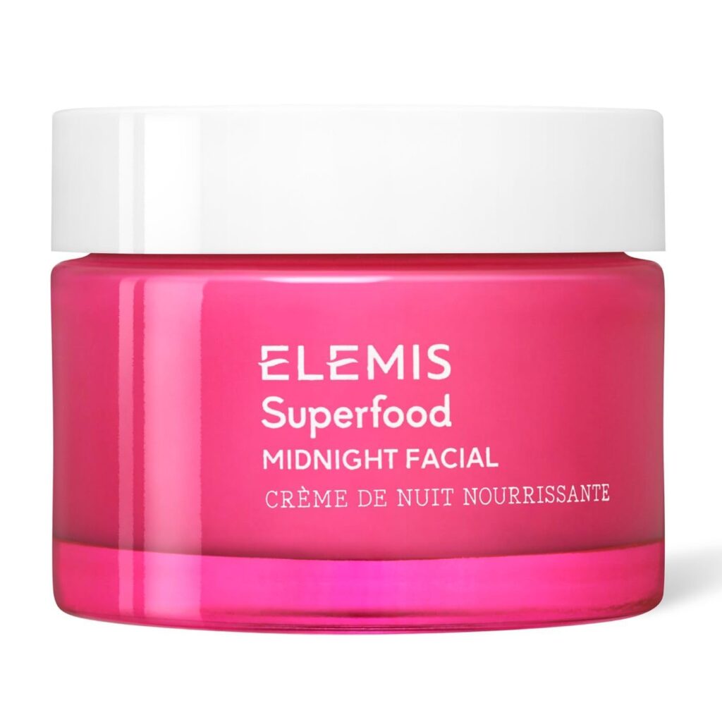 A bright pink jar of Elemis Superfood Midnight Facial cream with a white lid and white text on the front.