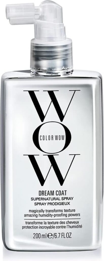 A silver bottle of COLOR WOW Dream Coat Supernatural Spray with a clear pump, featuring black text that highlights the product's name, benefits, and a volume of 200 ml (6.7 fl oz).