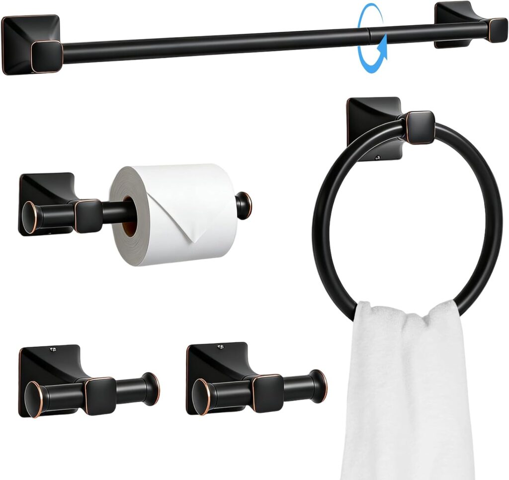 A sleek 5-Piece Stainless Steel Bathroom Hardware Set, featuring a towel bar, towel ring, toilet paper holder with roll, and two robe hooks—all designed with square bases and bronze accents. This modern Bathroom Hardware set includes one hook holding a white towel.