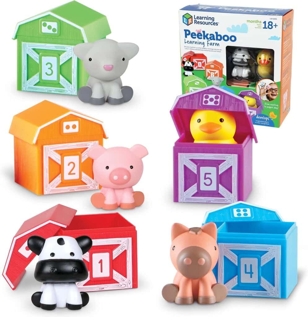 Five colorful barns numbered 1-5, each with a matching animal figure: cow, sheep, pig, duck, and horse. A Peekaboo Learning Farm toy box is shown in the background.