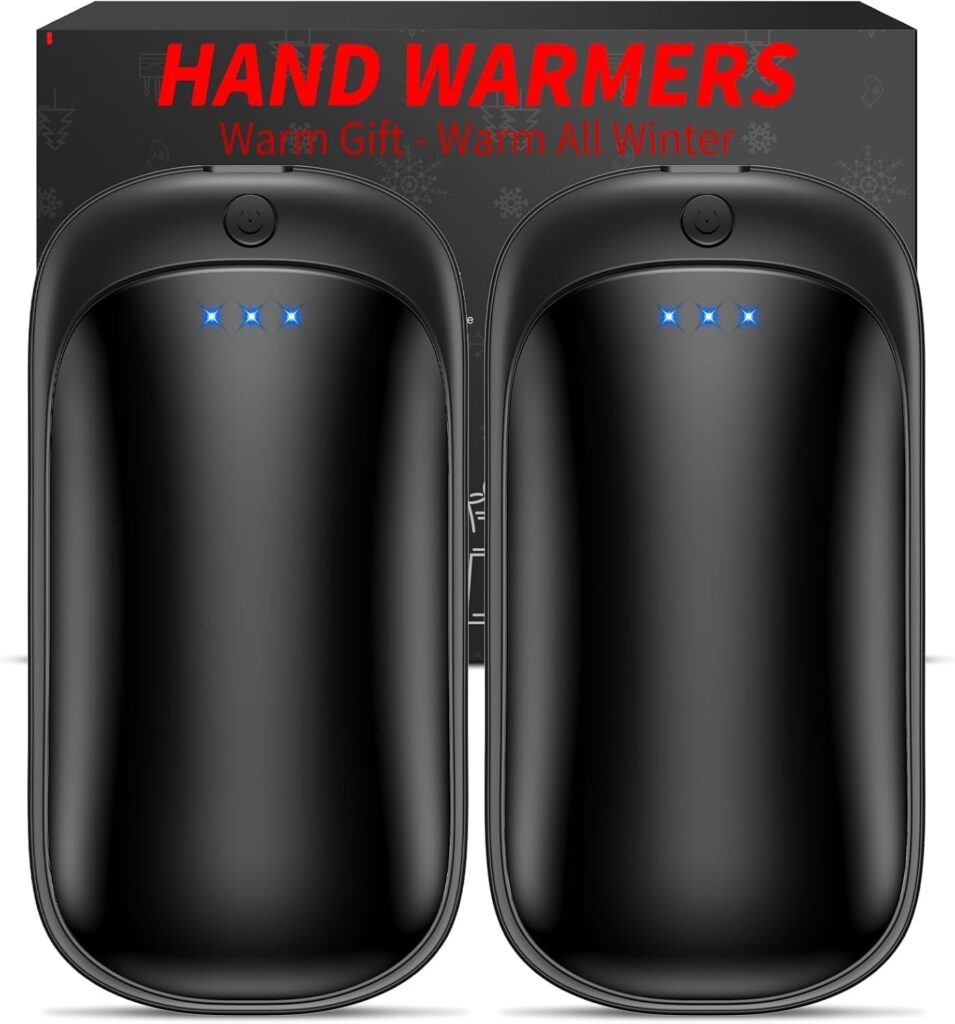Two black, oval-shaped electronic hand warmers with blue LED lights are displayed side by side. The packaging behind them reads “HAND WARMERS Warm Gift - Warm All Winter” in bold red and yellow text—perfect for gifting or enjoying yourself, especially with exclusive Friday Deals.