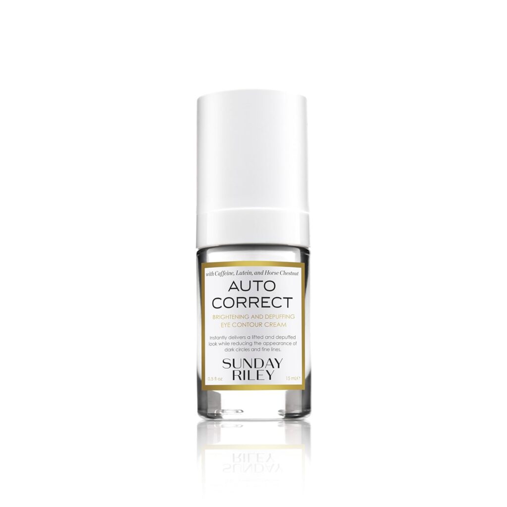 A bottle of Sunday Riley Auto Correct Brightening and Depuffing Eye Contour Cream with a white cap and clear base, displayed on a white background.