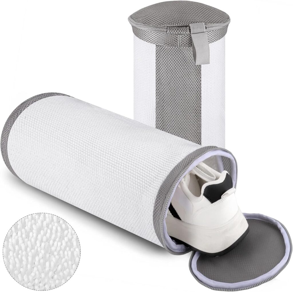 Two cylindrical white mesh laundry bags with gray trim; one stands upright and the other lies on its side, partially open with a white sneaker inside. Inset shows a close-up of the mesh fabric texture.