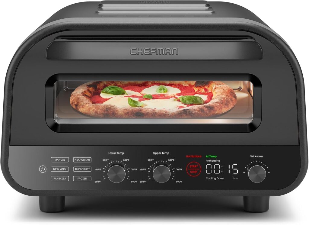 A countertop pizza oven baking a margherita pizza, with basil leaves on top. The oven display shows 01:15 remaining, and has various temperature and function dials on the front panel.
