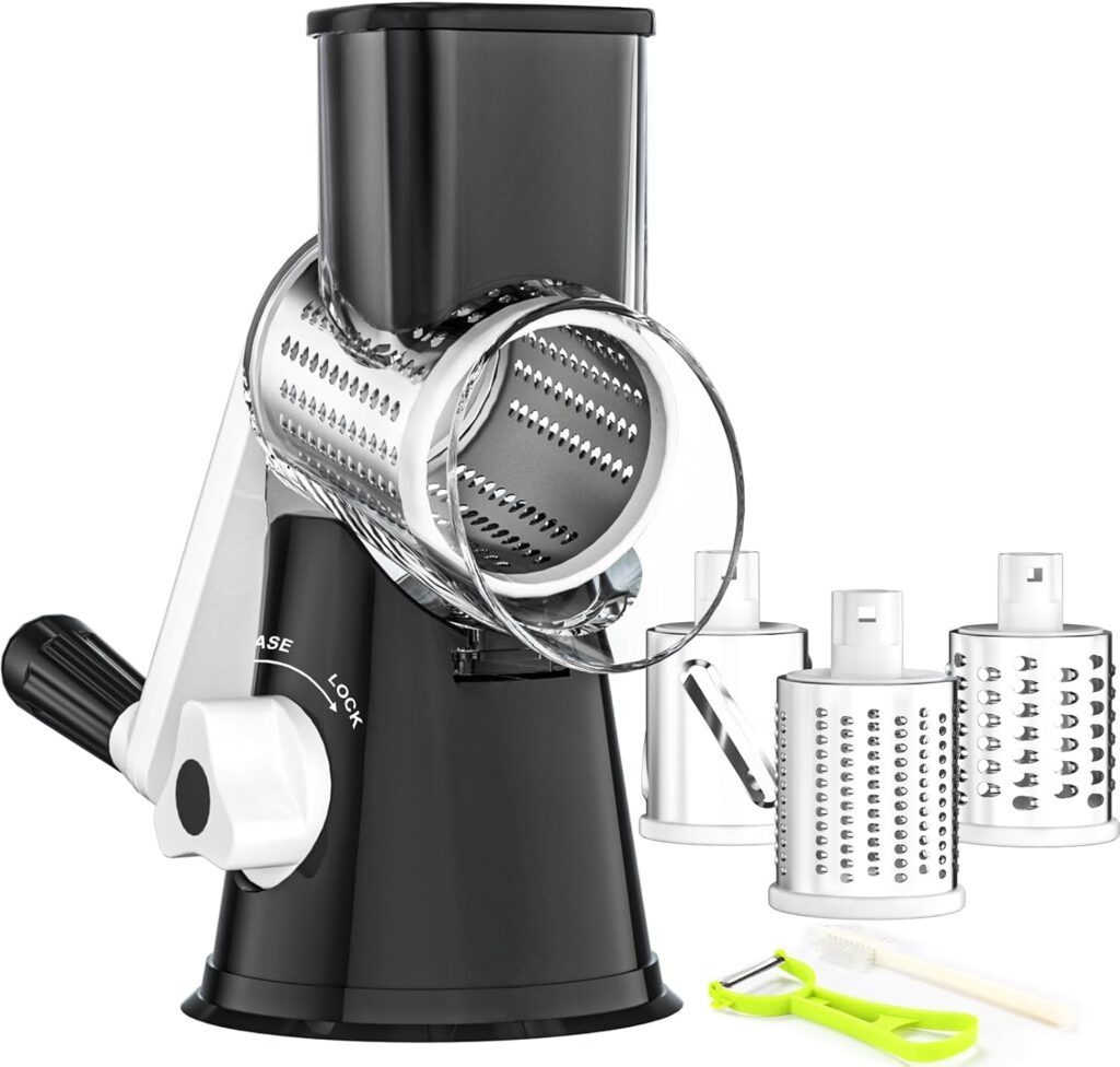 A black rotary cheese grater with a handle, three interchangeable grating drums, a small green peeler, and a cleaning brush displayed on a white background—perfect for upgrading your kitchen essentials with our exclusive Monday Deals.