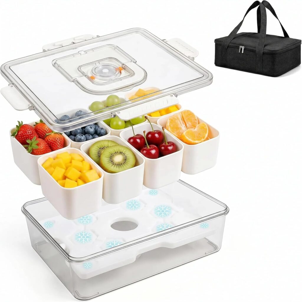 Clear produce container with eight small compartments holding assorted fruits, including strawberries, blueberries, mango, kiwi, cherries, grapes, and orange slices; includes an ice pack and a black carrying bag.