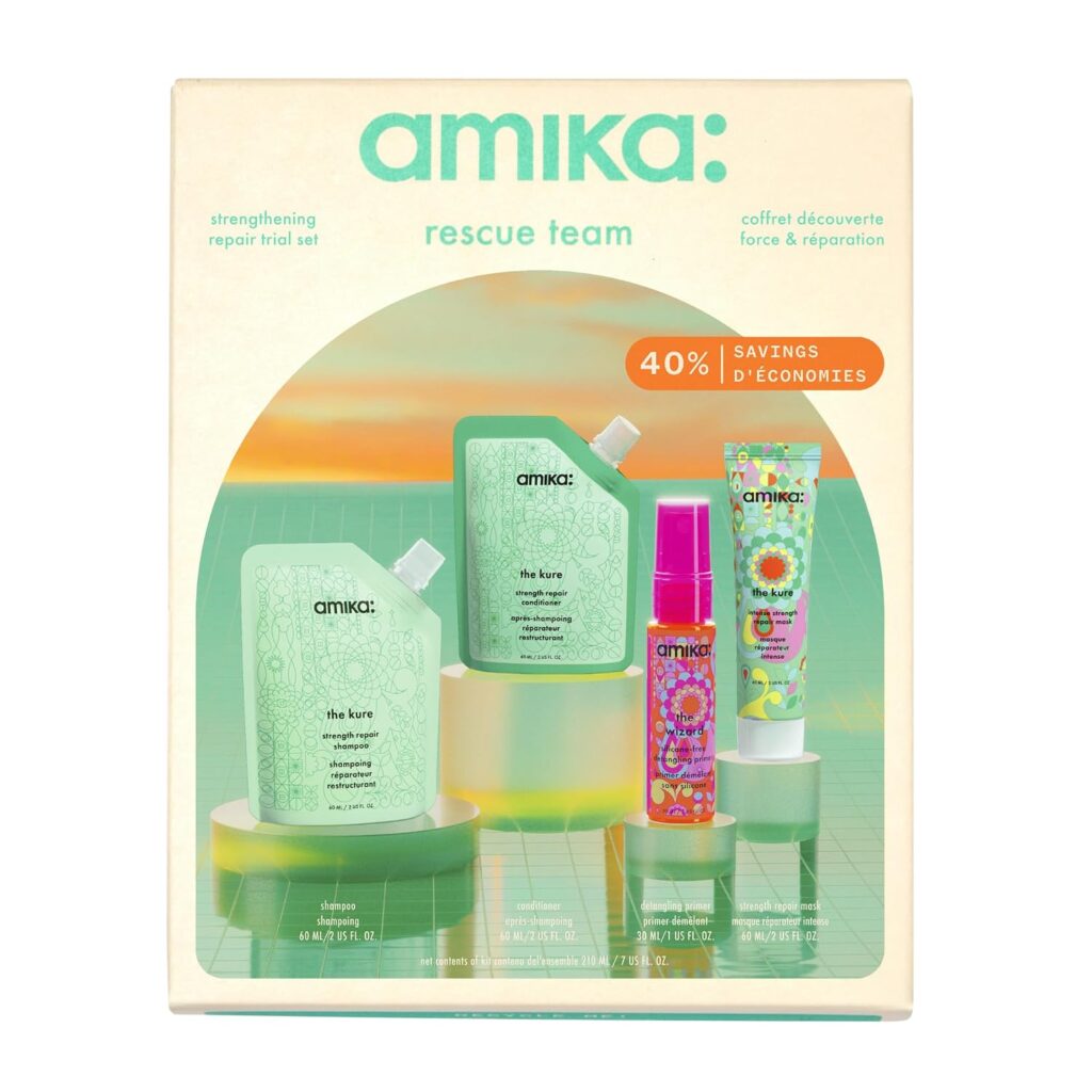 Amika Rescue Team trial set box featuring strengthening hair products: the perfect way to upgrade your hair routine. The set includes two green pouches, a colorful spray bottle, and a tube—all neatly packaged with a 40% savings label on the upper right and displayed against a mint green grid background.