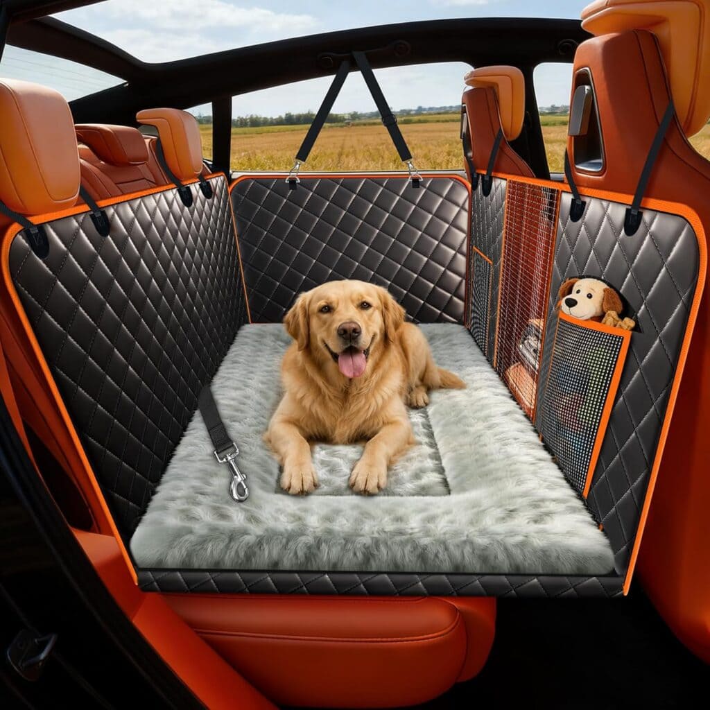 A golden retriever sits on a plush gray mat in the backseat of a car with quilted black-and-orange seat covers. A stuffed toy is in a side pocket, making every trip special—especially with Monday Deals waiting for you.