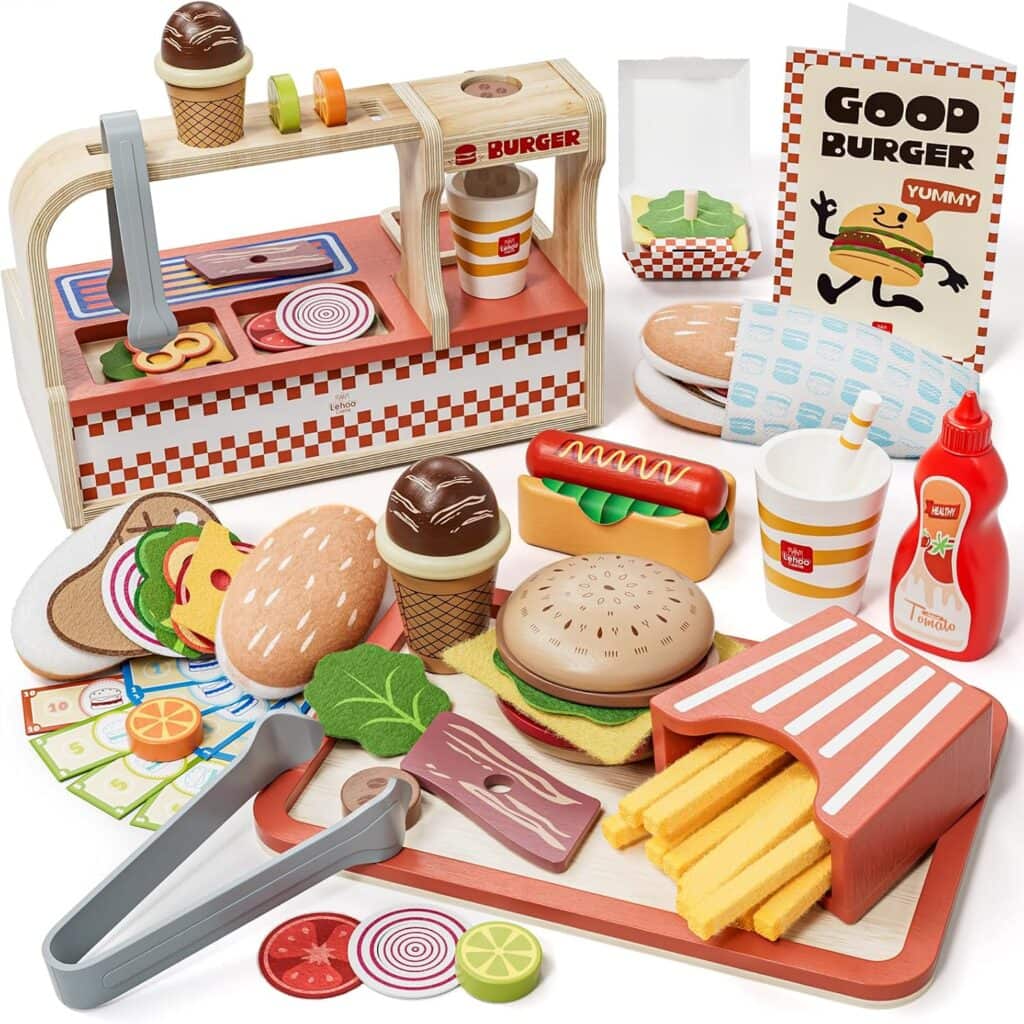Toy fast food set with wooden burgers, fries, hot dog, ice cream, condiments, play money, menu, cups, and tongs arranged on a table, designed for imaginative play.