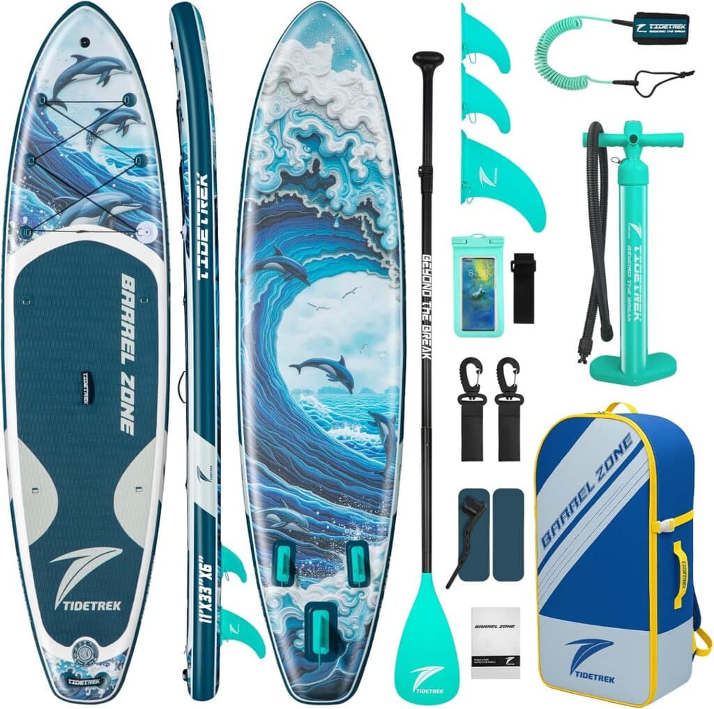 Inflatable stand-up paddle board set with ocean and dolphin graphics, paddle, fins, pump, backpack, leash, phone pouch, and repair kit, all displayed on a white background.