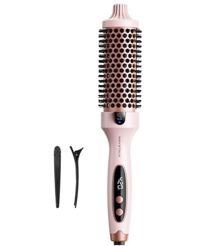 A pink electric hair styling brush with a digital display and buttons, accompanied by a black hair clip and a black hair sectioning tool, all on a white background.