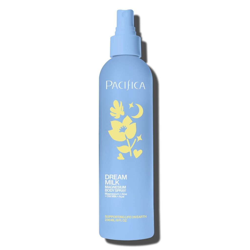 Light blue bottle of Pacifica Dream Milk Magnesium Body Spray with yellow floral and celestial graphics and a spray nozzle. Text includes product name and volume, 236 mL (8 fl oz). Perfect for adding to your self-care routine or grabbing during Monday Deals.