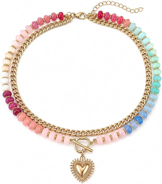 A gold chain necklace with colorful beads, featuring a heart-shaped pendant and toggle clasp, is displayed on a white background—perfect for adding to your collection during our Monday Deals.