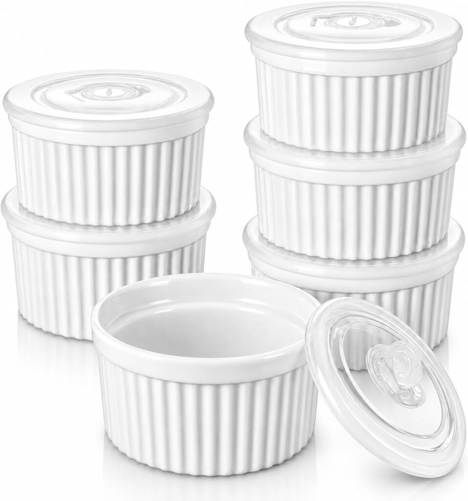 Six white ceramic ramekins with lids are stacked in two piles; one ramekin is open with its lid resting beside it, all displayed on a white background—perfect for taking advantage of our Monday Deals.