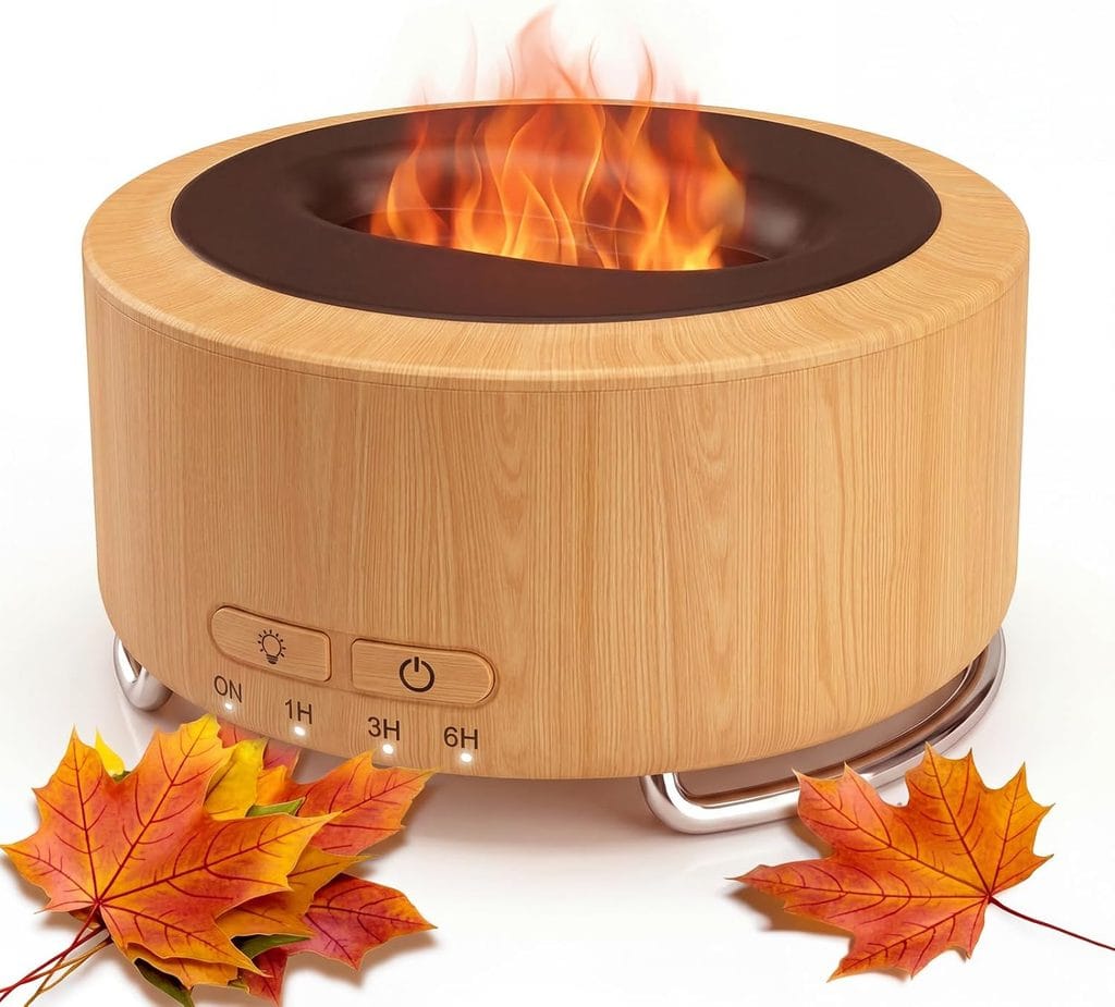 A round, wood-patterned tabletop fire pit with a realistic flame, control buttons on the front, and autumn leaves placed around the base—perfect for cozy evenings and available now as part of our exclusive Wednesday Deals.