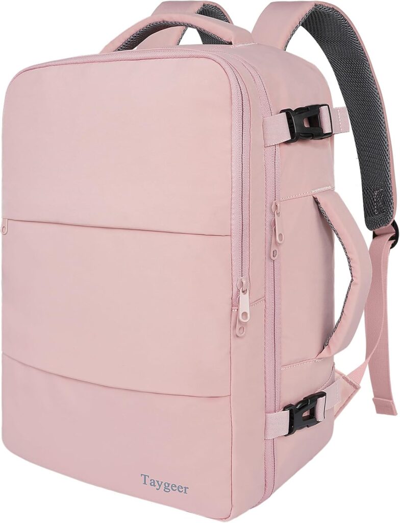 A light pink travel backpack with side handles, front zipper pockets, adjustable shoulder straps, side buckles, and the brand name “Taygeer” on the lower front.