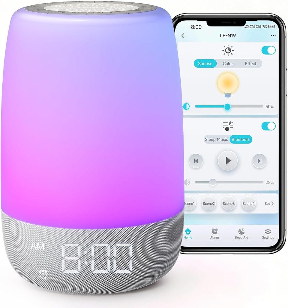 A smart alarm clock with a glowing, color-changing LED light next to a smartphone displaying an app interface for controlling the light color, brightness, and music settings.